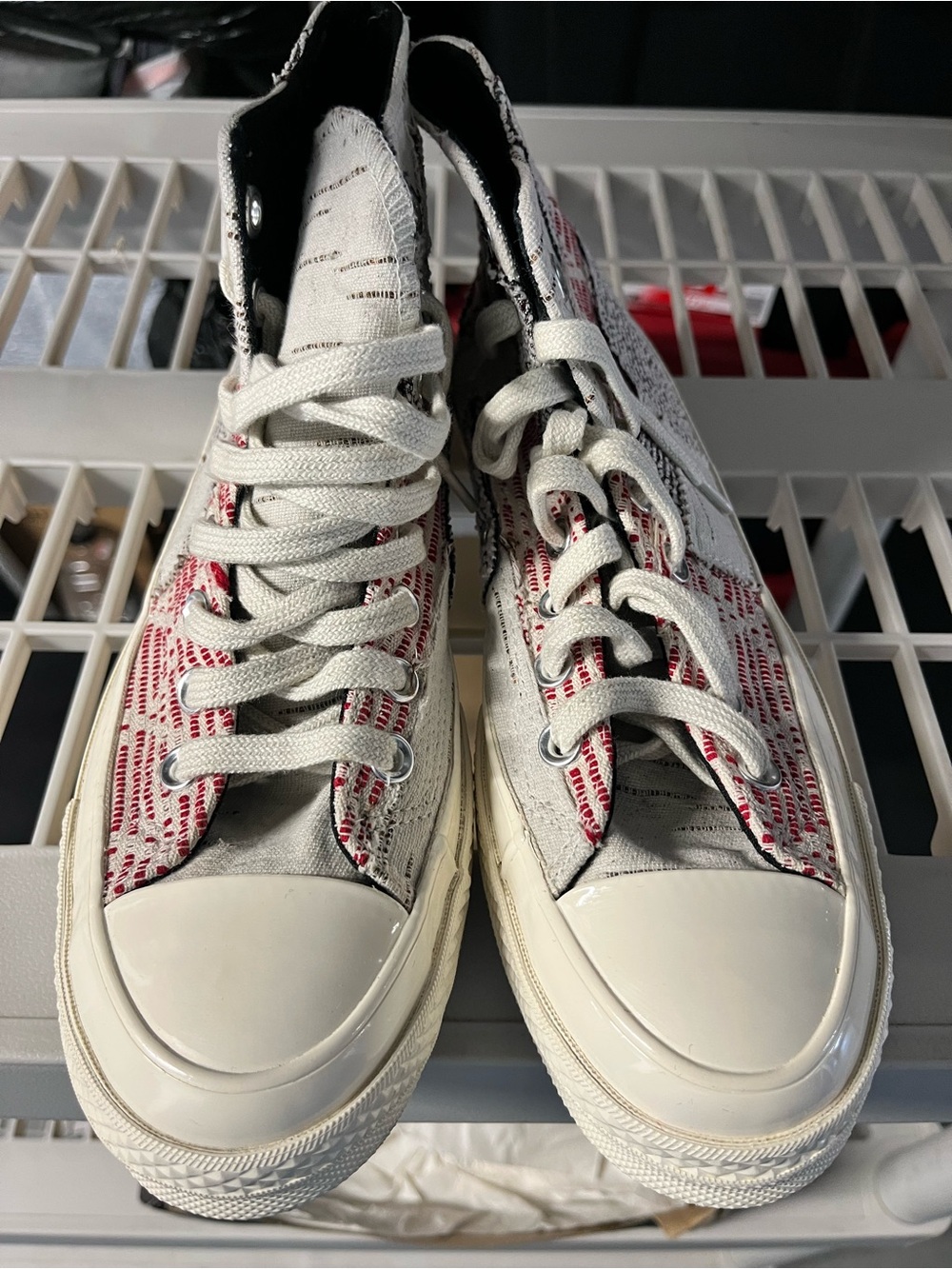 Converse high top sneakers in white and red woven pattern